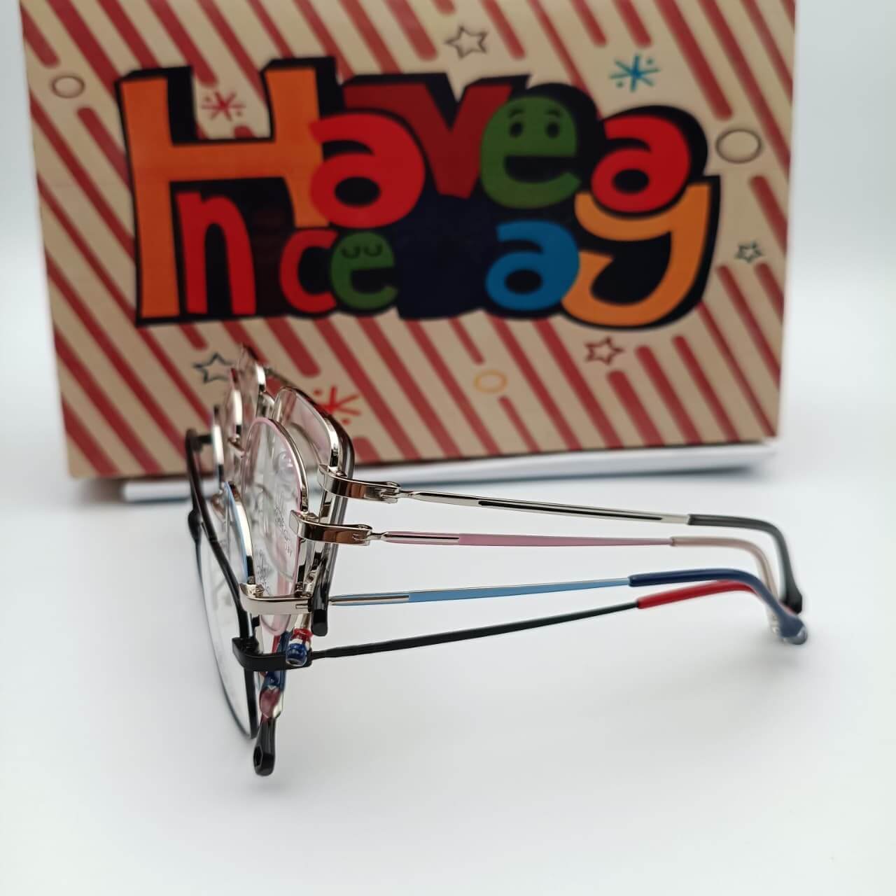 Stylish glasses next to colorful background