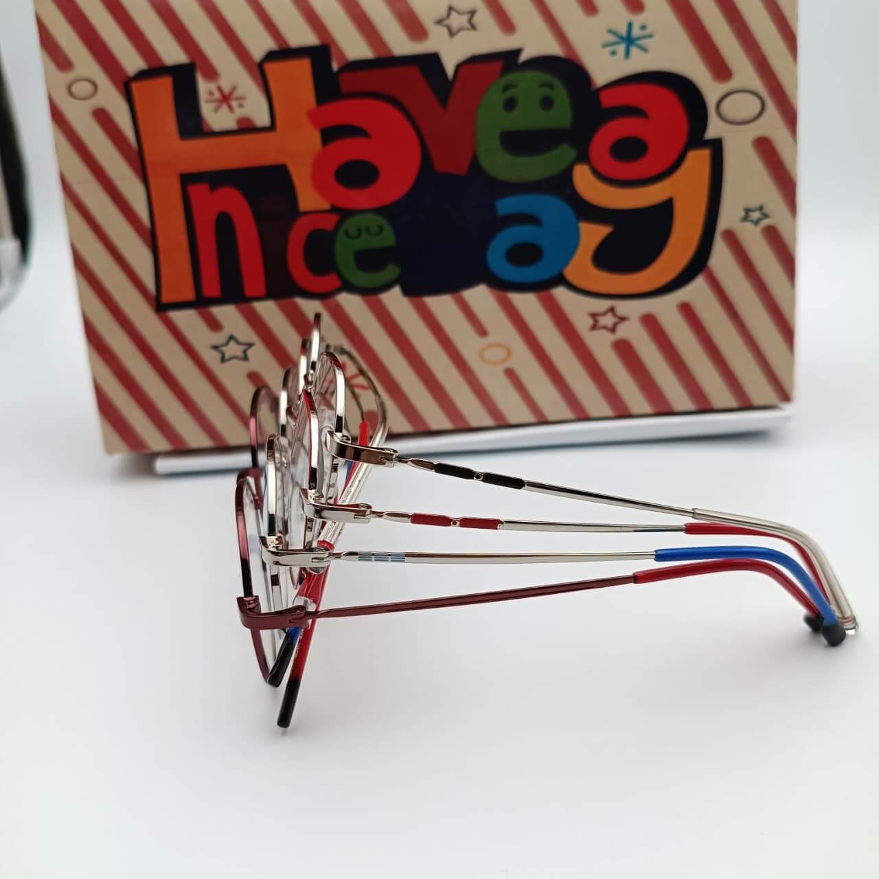 Colorful glasses beside a greeting card